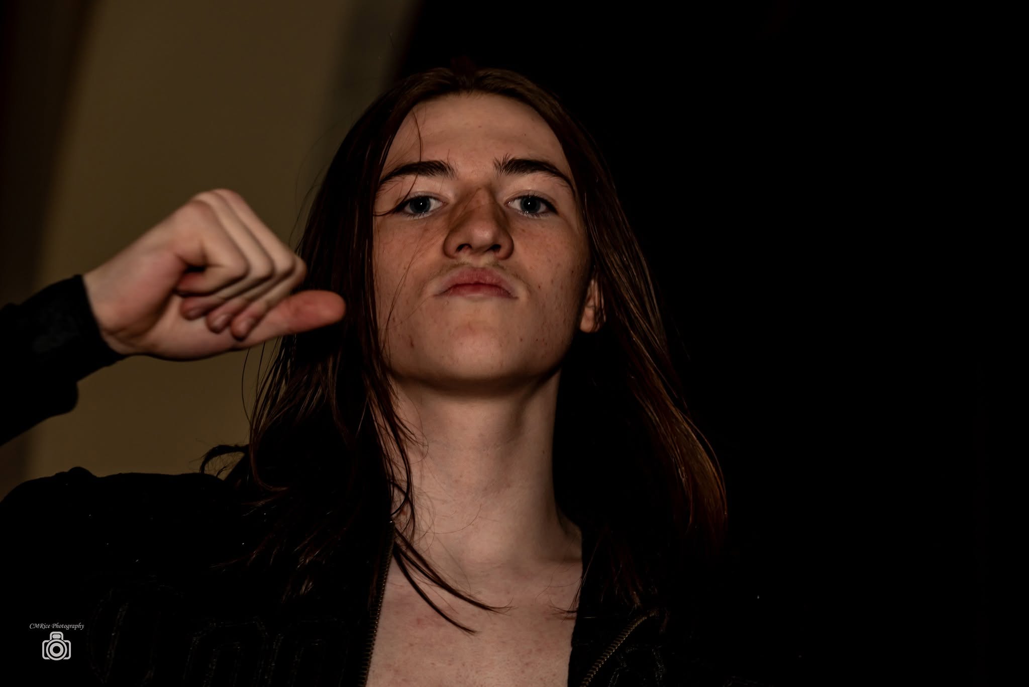 Carter Cash gestures toward himself at Vendetta at the Opera House